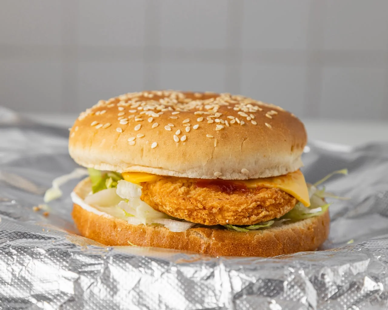 Crispy chicken sandwich with cheese and lettuce