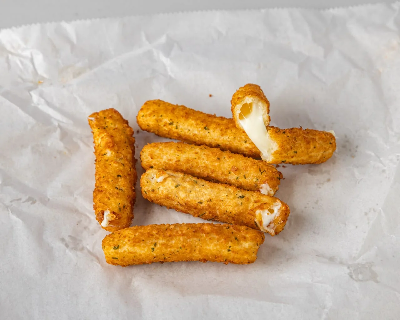 Mozzarella sticks with melted cheese pull