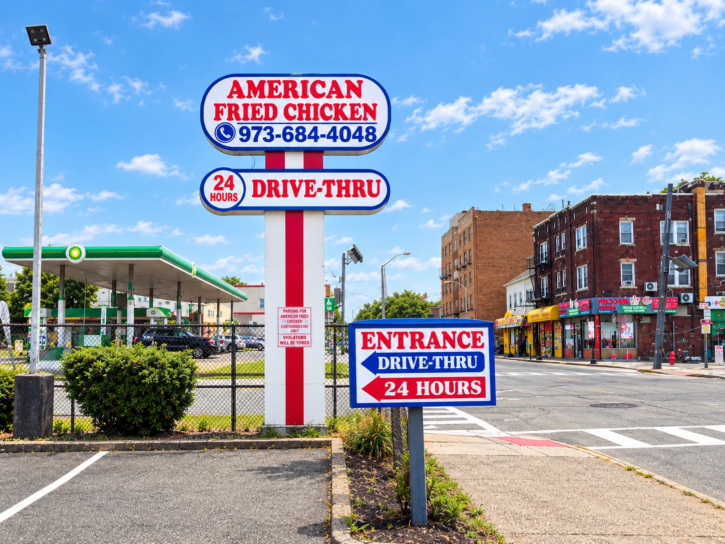 American Fried Chicken drive-thru entrance and pylon sign